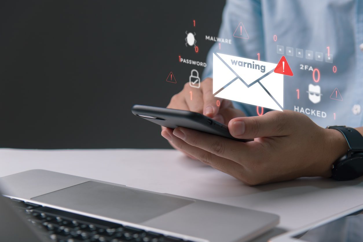 Business email compromise. Opening email on phone.